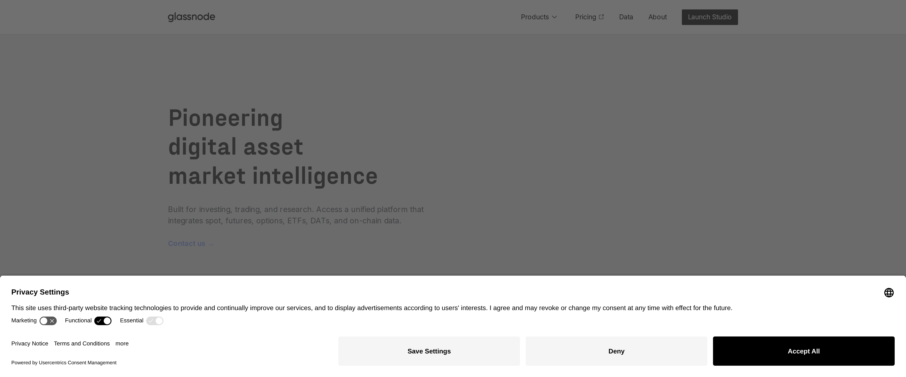 Glassnode homepage headline reading Pioneering digital asset market intelligence, above a subheading about a unified platform integrating spot, futures, options, ETFs, DATs and on-chain data